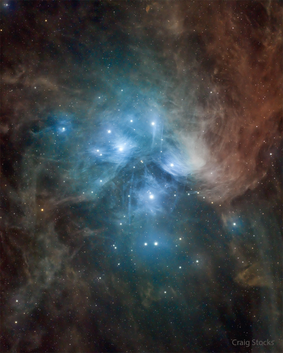 The famous Pleiades star cluster is shown surrounded by
dust. Dust near the bright stars reflects blue light, but dust
further away appears more red.
Please see the explanation for more detailed information.